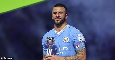 Soccer Football - Club World Cup - Final - Manchester City v Fluminense - King Abdullah Sports City, Jeddah, Saudi Arabia - December 22, 2023 Manchester City s Kyle Walker celebrates on the podium with the silver ball trophy after the match REUTERS/Amr Abdallah Dalsh