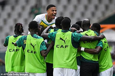 Senegal s players celebrate after scoring their team s first goal during the Africa Cup of Nations (CAN) 2024 group C football match between Senegal and Gambia at Stade Charles Konan Banny in Yamoussoukro on January 15, 2024. (Photo by Issouf SANOGO / AFP) (Photo by ISSOUF SANOGO/AFP via Getty Images)