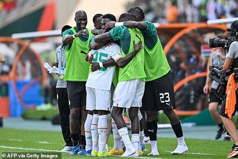 Senegal s midfielder #25 Lamine Camara (C) celebrates with teammates after scoring his team s second goal during the Africa Cup of Nations (CAN) 2024 group C football match between Senegal and Gambia at Stade Charles Konan Banny in Yamoussoukro on January 15, 2024. (Photo by Issouf SANOGO / AFP) (Photo by ISSOUF SANOGO/AFP via Getty Images)