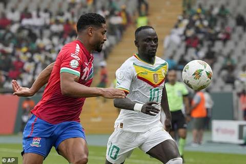 Senegal s Sadio Mane, right, vies for the ball with Gambia s Saidy Janko during the African Cup of Nations Group C soccer match between Senegal and Gambia at the Charles Konan Banny stadium in Yamoussoukro, Ivory Coast, Monday, Jan. 15, 2024. (AP Photo/Sunday Alamba)