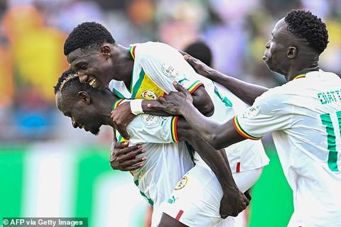 Senegal s midfielder #25 Lamine Camara (C) celebrates with teammates after scoring his team s third goal during the Africa Cup of Nations (CAN) 2024 group C football match between Senegal and Gambia at Stade Charles Konan Banny in Yamoussoukro on January 15, 2024. (Photo by Issouf SANOGO / AFP) (Photo by ISSOUF SANOGO/AFP via Getty Images)