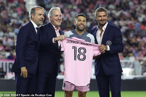 Alba is presented his jersey by co-owners Jose Mas (left), Jorge Mas and David Beckham (right)