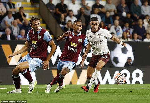 Phil Foden (right) justified the manager s faith in including him from the start and played the full 90 minutes at Turf Moor