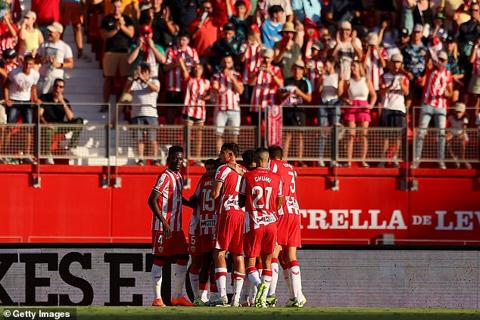 Almeria players celebrate after Sergio Arribas gave them an early lead against Real Madrid