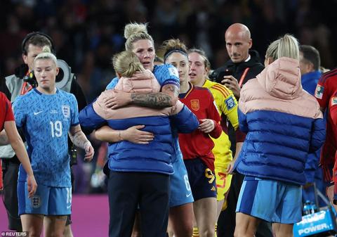 Captain Millie Bright (centre) embraces manager Sarina Wiegman after failing to lead her Lionesses to World Cup glory
