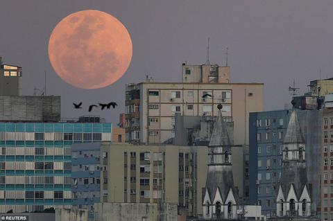 BRAZIL: The moon was a dominating presence over the city of Porto Alegres in Brazil