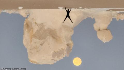 EGYPT: One budding photographer did a handstand as the super blue moon lit up the skies behind him in Egypt