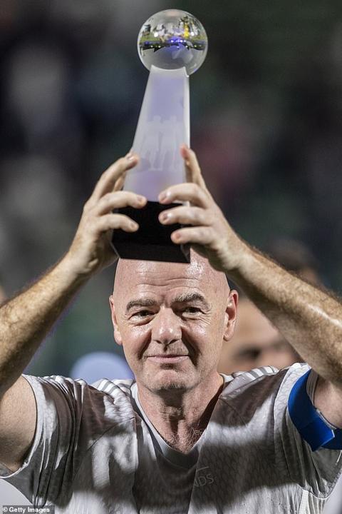 FIFA president Gianni Infantino was seen lifting a trophy but the score remains unclear