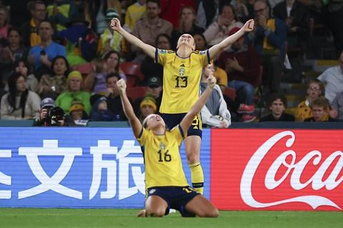 Sweden´s Amanda Ilestedt, top, and Filippa Angeldal celebrate victory (Tertius Pickard/AP)