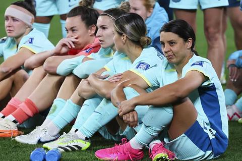 Australia s Sam Kerr, right, sits with her teammates following their loss to Sweden in the Women s World Cup third place playoff soccer match in Brisbane, Australia, Saturday, Aug. 19, 2023. (AP Photo/Tertius Pickard)