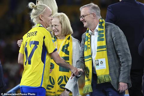Australian Prime Minister Anthony Albanese, right, shakes hands within Sweden s Caroline Seger as they receive their bronze medals after defeating Australia in the Women s World Cup third place playoff soccer match in Brisbane, Australia, Saturday, Aug. 19, 2023. (AP Photo/Tertius Pickard)