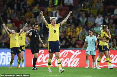 Sweden s Lina Hurtig celebrates with teammates after defeating Australian in the Women s World Cup third place playoff soccer match in Brisbane, Australia, Saturday, Aug. 19, 2023. (AP Photo/Tertius Pickard)