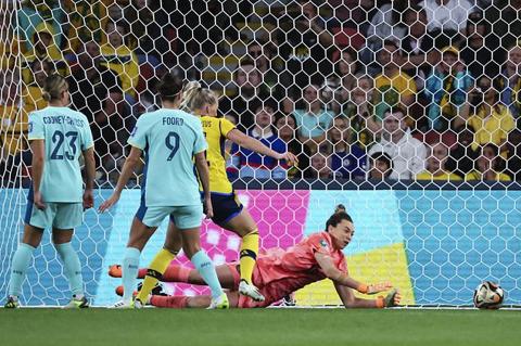 Australia s goalkeeper Mackenzie Arnold dives to make a save during the Women s World Cup third place playoff soccer match between Australia and Sweden in Brisbane, Australia, Saturday, Aug. 19, 2023. (AP Photo/Tertius Pickard)