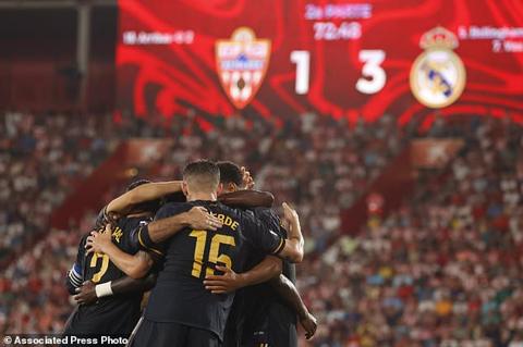Real Madrid players celibrate after Vinicius Junior scored his side s third goal during a Spanish La Liga soccer match between Almeria and Real Madrid at the Power Horse Stadium in Almeria, Spain, Saturday, Aug. 19, 2023. (AP Photo/Fermin Rodriguez)