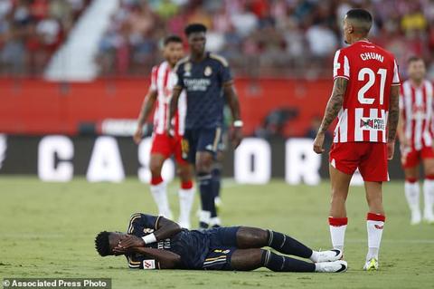 Real Madrid s Vinicius Junior lies on the ground during a Spanish La Liga soccer match between Almeria and Real Madrid at the Power Horse Stadium in Almeria, Spain, Saturday, Aug. 19, 2023. (AP Photo/Fermin Rodriguez)