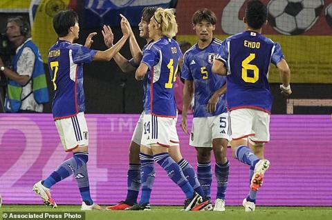 Japan s Ayase Ueda, centre left, celebrates after scoring his side s second goal during an international friendly soccer match between Germany and Japan in Wolfsburg, Germany, Saturday, Sept. 9, 2023. (AP Photo/Martin Meissner)