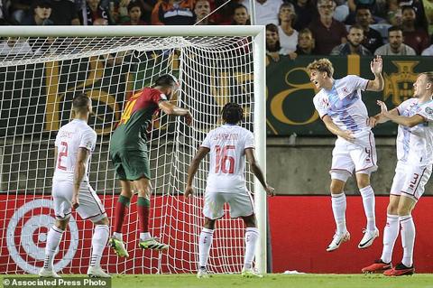 Portugal s Goncalo Inacio, 2nd left, scores his side s fourth goal during the Euro 2024 group J qualifying soccer match between Portugal and Luxembourg at the Algarve stadium outside Faro, Portugal, Monday, Sept. 11, 2023. (AP Photo/Joao Matos)