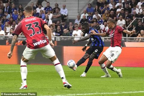 Inter Milan s Marcus Thuram, center, scores his side s 2nd goal during a Serie A soccer match between Inter Milan and AC Milan at the San Siro stadium in Milan, Italy, Saturday, Sept.16, 2023. (AP Photo/Antonio Calanni)