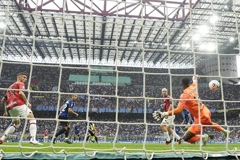 Inter Milan s Henrikh Mkhitaryan, second from left, scores his side s first goal during a Serie A soccer match between Inter Milan and AC Milan at the San Siro stadium in Milan, Italy, Saturday, Sept.16, 2023. (AP Photo/Antonio Calanni)