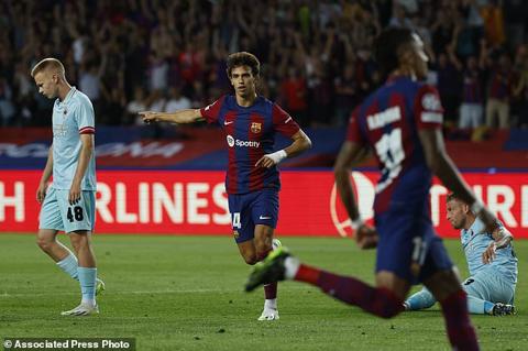 Barcelona s Joao Felix, center, celebrates after scoring his side s opening goal during the Champions League Group H soccer match between Barcelona and Royal Antwerp at the Olympic Stadium of Montjuic in Barcelona, Spain, Tuesday, Sept. 19, 2023. (AP Photo/Joan Monfort)