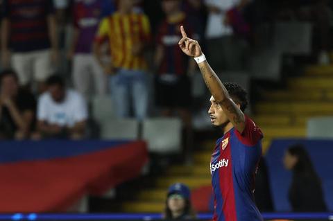 Barcelona s Raphinha celebrates after Royal Antwerp s Jelle Bataille scored an own goal during the Champions League Group H soccer match between Barcelona and Royal Antwerp at the Olympic Stadium of Montjuic in Barcelona, Spain, Tuesday, Sept. 19, 2023. (AP Photo/Joan Monfort)