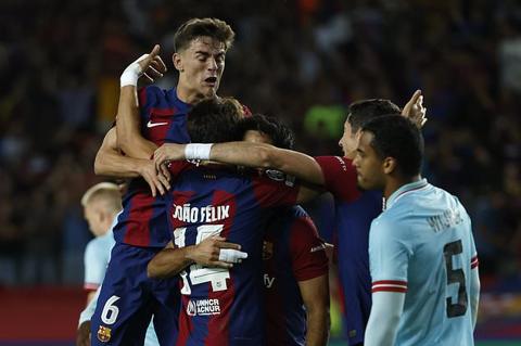 Barcelona s Joao Felix, foreground, celebrates with his teammates after scoring his side s opening goal during the Champions League Group H soccer match between Barcelona and Royal Antwerp at the Olympic Stadium of Montjuic in Barcelona, Spain, Tuesday, Sept. 19, 2023. (AP Photo/Joan Monfort)