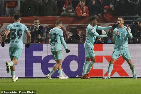 Barcelona s Ferran Torres, right, celebrates with teammates after scoring his sides first goal during the Champions League Group H soccer match between Antwerp and Barcelona at the Bosuil stadium in Deurne, Belgium, Wednesday, Dec. 13, 2023. (AP Photo/Geert Vanden Wijngaert)