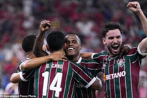 Fluminense s Jhon Arias, center, celebrates after scoring the opening goal during the Soccer Club World Cup semifinal soccer match between Fluminense FC and Al Ahly FC at King Abdullah Sports City Stadium in Jeddah, Saudi Arabia, Monday, Dec. 18, 2023. (AP Photo/Manu Fernandez)