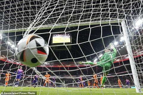 Netherlands goalkeeper Bart Verbruggen fails to make a save during the international friendly soccer match between Germany and Netherlands at the Deutsche Bank Park in Frankfurt, Germany on Tuesday, March 26, 2024. (AP Photo/Martin Meissner)