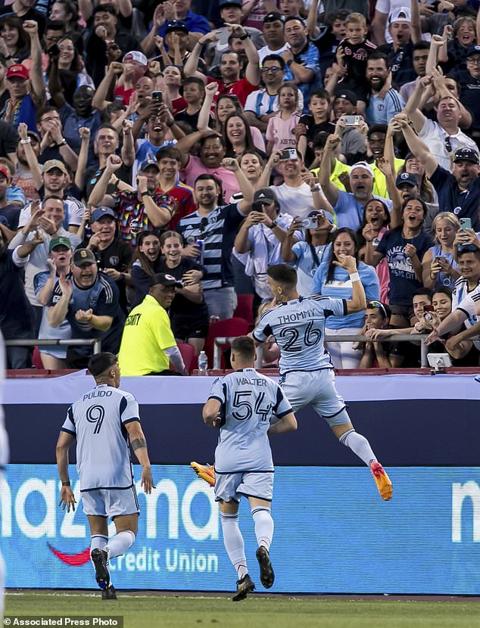 Sporting Kansas City midfielder Erik Thommy (26) celebrates after a score during the first half of an MLS soccer match against Inter Miami, Saturday, April 13, 2024, in Kansas City, Mo. (AP Photo/Nick Tre. Smith)
