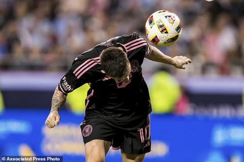 Inter Miami forward Lionel Messi attempts a header during the first half of an MLS soccer match against Sporting Kansas City, Saturday, April 13, 2024, in Kansas City, Mo. (AP Photo/Nick Tre. Smith)